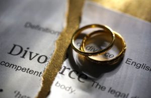 divorce papers and rings