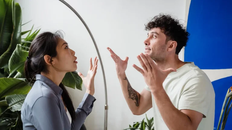 Man and woman having an intense argument indoors.